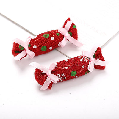 Six colorful fabric pet toys shaped like wrapped candies, featuring plaid, polka dot, and snowflake patterns. - Image 6
