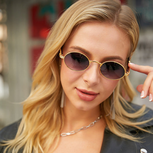 Retro oval sunglasses with gold metal frames and dark wood-like temples, featuring gradient black lenses. - Image 14