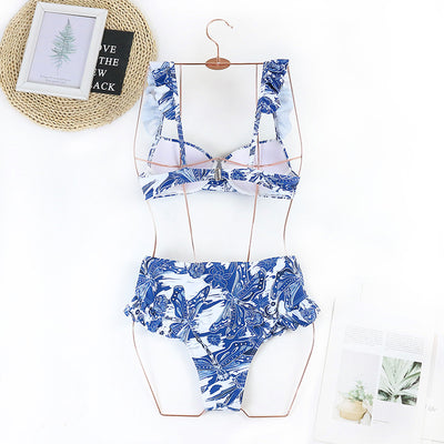 Purple and white floral high-waisted bikini with ruffled straps and push-up bandeau top. - Image 4