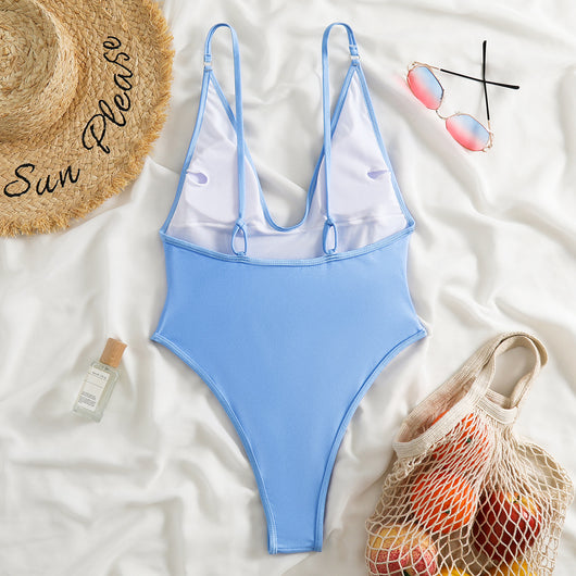 Dark brown one-piece swimsuit with a deep V-neckline and thin adjustable straps, styled with a straw hat and sunglasses. - Image 10
