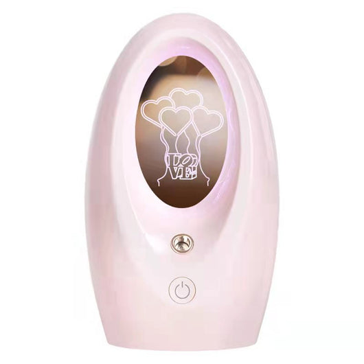 Navy blue USB humidifier with an oval shape and an illuminated castle design in the center. - Image 7