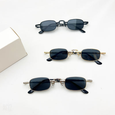 Black retro hip hop sunglasses with dark rectangular lenses and a sleek metal frame on a white background.