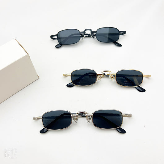 Black retro hip hop sunglasses with dark rectangular lenses and a sleek metal frame on a white background.
