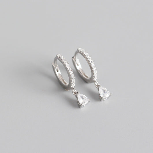 Silver-colored hoop earrings with black pave stones and dangling black teardrop-shaped stones. - Image 3