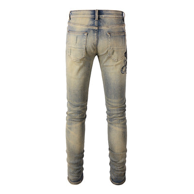 Jeans Slim Fit Desgastados con Bordado de Serpiente de Tres Cabezas y Parches de Cuero - Image 3
