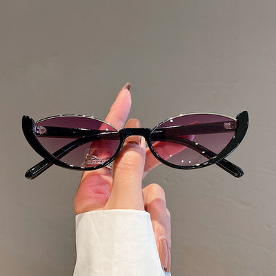 Pink cat-eye sunglasses with purple gradient lenses on a white background, showcasing a trendy style. - Image 4