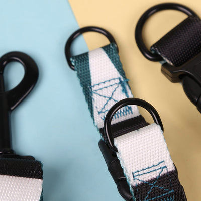 Pink, black, and white patterned polyester dog leash with a silver metal swivel snap hook, coiled on a white background. - Image 4