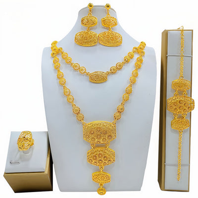 Gold-colored fashion jewelry set with a two-layer necklace, drop earrings, bracelet, and ring, all featuring intricate leaf and floral filigree designs. - Image 2