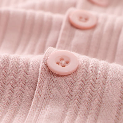 Beige ribbed cotton children's pajama set with long-sleeved lapel top and matching pants, featuring black trim. - Image 7
