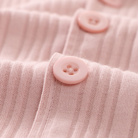 Beige ribbed cotton children's pajama set with long-sleeved lapel top and matching pants, featuring black trim. - Image 7