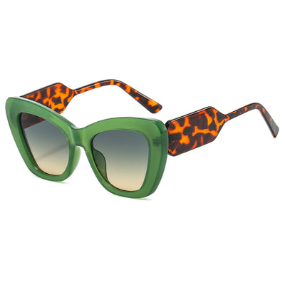Pink cat-eye sunglasses with green temples and brown to pink gradient lenses on a white background. - Image 5