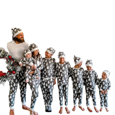 Family of seven and a dog in matching grey Christmas tree print pajamas with white cuffs and beanies. - Image 4
