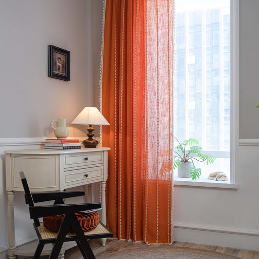 Black polyester curtain with white jacquard multi-line pattern and black tassels, draped over a white chair. - Image 22