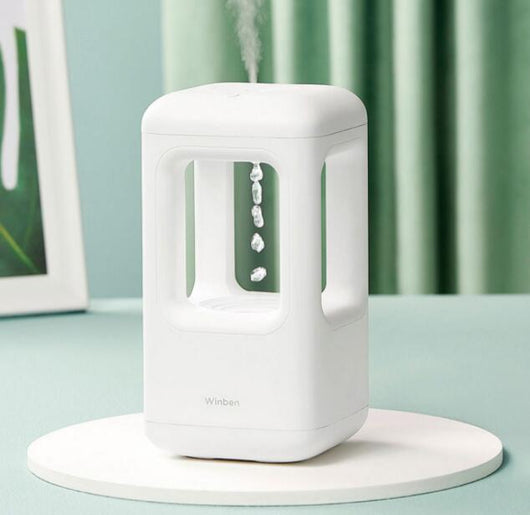 White anti-gravity water drop humidifier with visible mist output and 'Winben' brand name, on a white stand. - Image 6