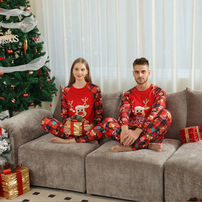 Family matching red Christmas pajamas with a cartoon reindeer and "Merry Christmas" text on a plaid background. - Image 18