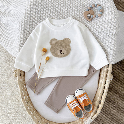 White long-sleeve baby hoodie with a brown bear print and matching ribbed beige sweatpants set.