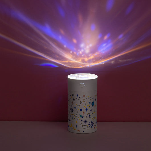 Dark green cylindrical humidifier with a clear top, featuring a colorful celestial pattern of stars, planets, and constellations. - Image 10