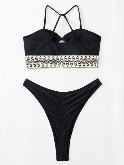 Black two-piece swimsuit with a bandeau top featuring a central O-ring, cut-out, and white zigzag embroidered trim, paired with matching high-cut bikini bottoms - Image 10