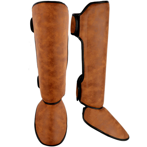 Pair of brown and black thickened shin guards for fighting and boxing, featuring a distressed leather-like texture. - Image 4