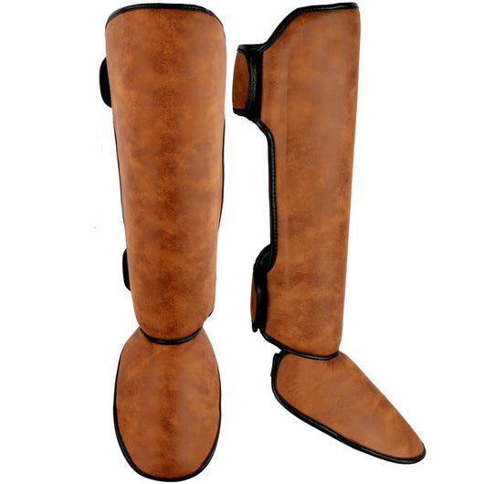 Pair of brown and black thickened shin guards for fighting and boxing, featuring a distressed leather-like texture. - Image 4