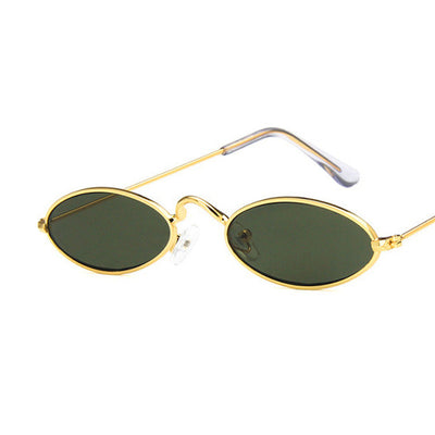 Retro oval frame sunglasses with vibrant red lenses and shiny gold-colored metal frames on a white background. - Image 5