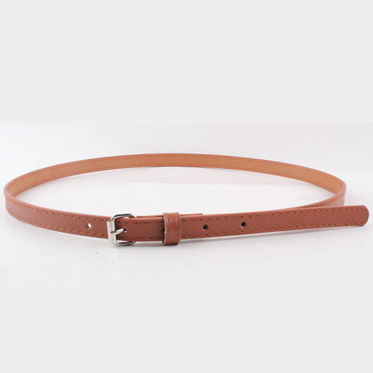 Thin brown imitation leather belt with a small silver D-shaped pin buckle, displayed on a white background.