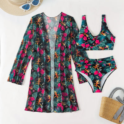 Multicolor tropical print three-piece swimsuit set with high-waisted bikini and sheer mesh cover-up on a beach. - Image 34