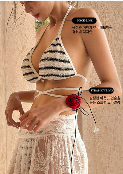 White and black striped bikini with triangle-cut top and tie-side bottom, modeled outdoors. - Image 30