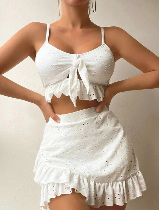 Light blue eyelet two-piece swimsuit set with a tie-front crop top and a matching ruffle-trim hip-hugging skirt. - Image 4