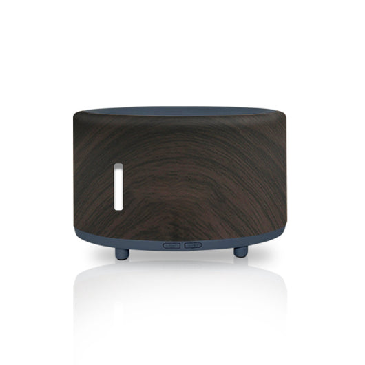 Two-tone cylindrical humidifier with a light body and dark base, featuring control buttons and small feet. - Image 4
