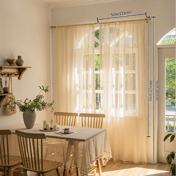 Light beige sheer lace curtains with bohemian patterns and tassel trim, hung on a wooden rod in a sunny room. - Image 3