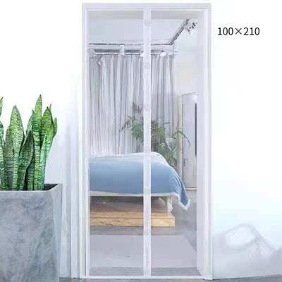 Black magnetic mosquito-proof curtain installed in a white doorway, with a puppy sitting in front of it. - Image 2