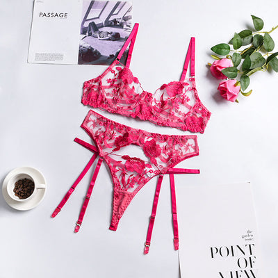 Purple embroidered lace three-piece lingerie set with underwire bra, thong, and garter belt on a white surface. - Image 6