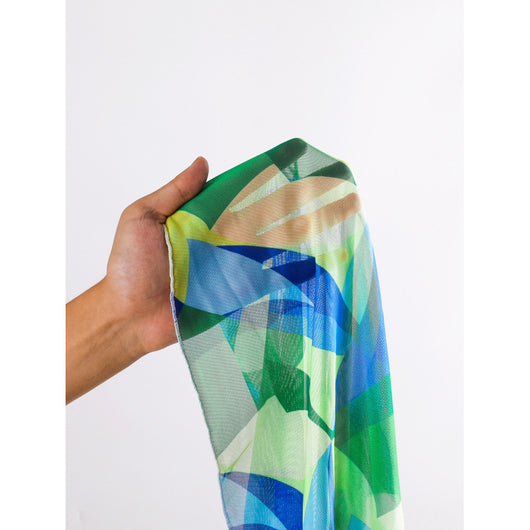 Sexy lace-up backless beach swimwear skirt set with a vibrant blue, green, and yellow geometric print. - Image 3
