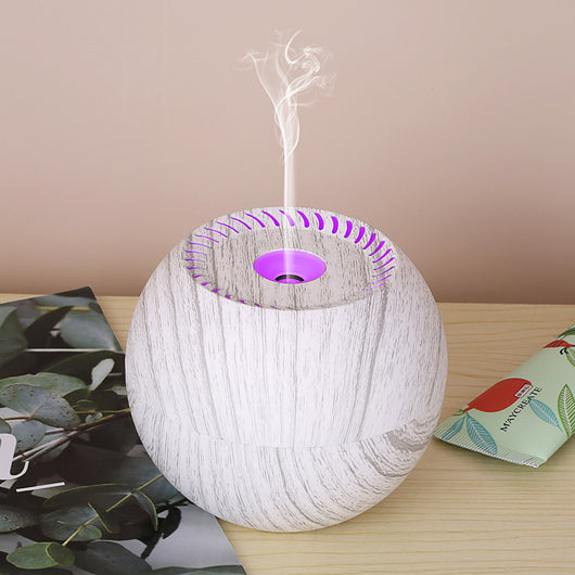 Dark wood grain spherical USB humidifier with a green light and mist emitting from the top, featuring a power button icon. - Image 8