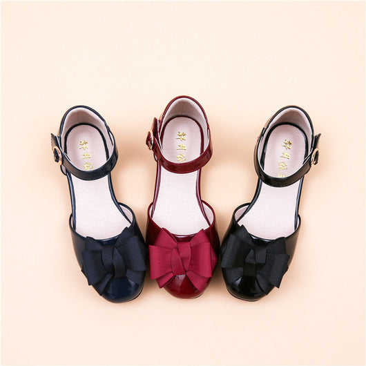 Dark red patent leather Mary Jane shoes for big kids, featuring a large grosgrain bow on the toe and a block heel. - Image 9