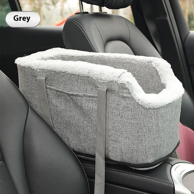 Grey pet car seat with plush white lining, designed for small dogs or cats, placed on a car's center console. - Image 6