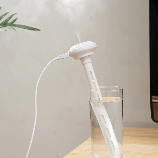 White USB humidifier with a long body, flat top, two cotton swabs, and an instruction manual on a white background. - Image 7