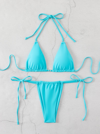 Brown bikini set with triangle top and thong bottom, featuring adjustable straps, displayed on a marble surface. - Image 13