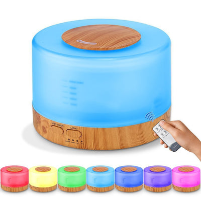 A cylindrical aromatherapy diffuser with a dark wood grain base and a translucent top glowing aqua blue, featuring control buttons. - Image 5