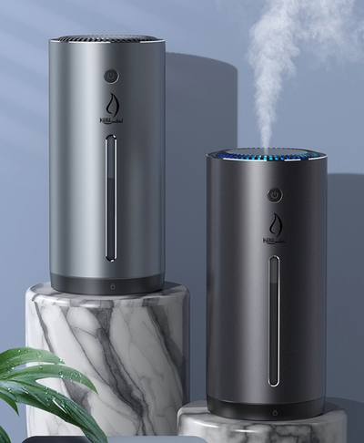 Dark gray cylindrical vehicle-mounted humidifier with a power button, mist outlet, and water level indicator. - Image 2