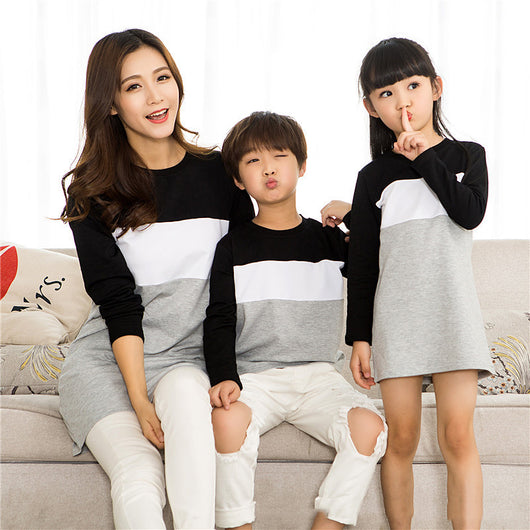 Matching black, white, and grey colorblock long-sleeved t-shirts for couples, worn by a man and a woman. - Image 6