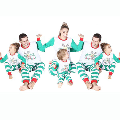 Family of four wearing matching green and white striped Christmas pajamas with a reindeer and "Merry Christmas" text. - Image 9