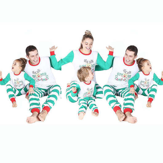 Family of four wearing matching green and white striped Christmas pajamas with a reindeer and "Merry Christmas" text. - Image 9