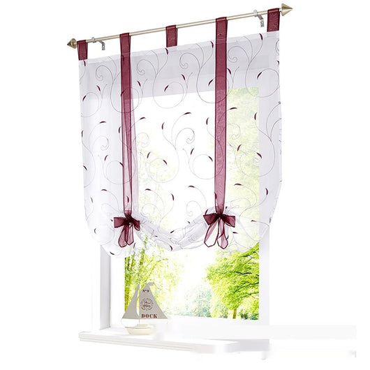 White sheer Roman window screen with red embroidered floral patterns and red ribbon ties, hanging from a silver rod. - Image 3