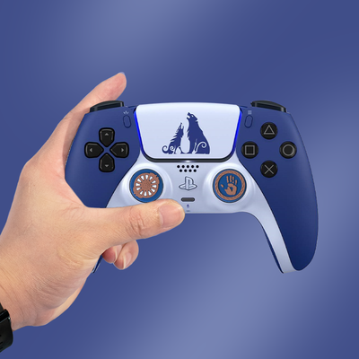 Blue silicone controller cover with white accents and wolf graphic, paired with thumb grips featuring handprint and gear designs. - Image 12