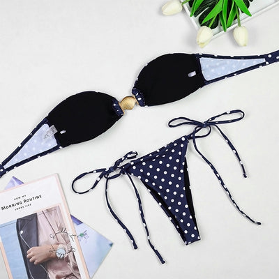 Woman in a navy blue polka dot tube top bikini and matching maxi skirt with side ties, posing outdoors. - Image 26