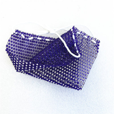 Close-up of a blue mesh fabric adorned with numerous small, clear rhinestones, creating a sparkling texture. - Image 67