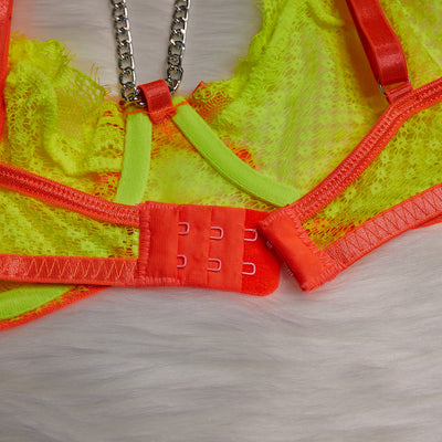 Neon yellow and orange lace lingerie set with chain details, including a bra, garter belt, thong, and armbands. - Image 31