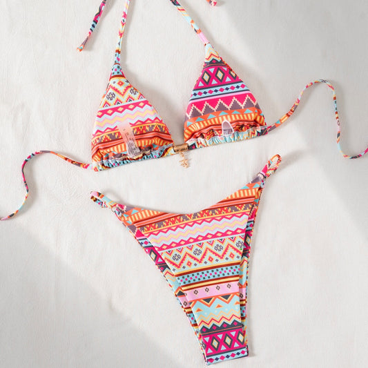 Vibrant geometric print triangle-bra bikini swimsuit with adjustable ties and high-cut ruched bottom. - Image 2